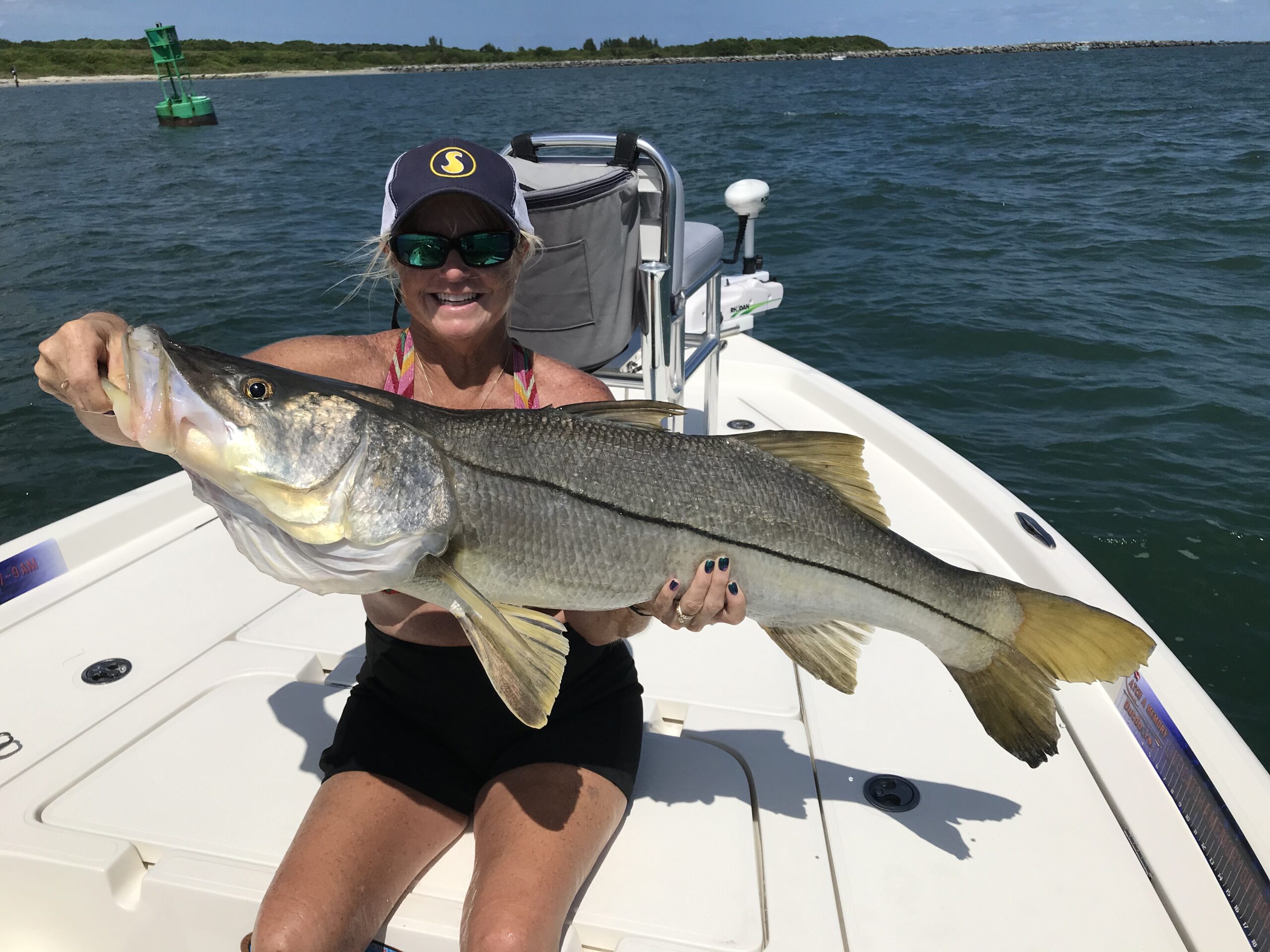 Fishing captain lands first 40-inch redfish; client snags 40-inch snook